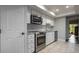 Well-equipped kitchen showcases stainless steel oven, microwave, and granite countertops at 200 Gretchen Ct, Oldsmar, FL 34677