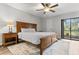Cozy main bedroom features natural lighting, ceiling fan, and a plush rug at 200 Gretchen Ct, Oldsmar, FL 34677