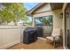 Outdoor patio with comfortable chair and grill, perfect for relaxation at 200 Gretchen Ct, Oldsmar, FL 34677