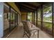 Inviting screened patio features tile flooring and serene lake views to enjoy the outdoors at 200 Gretchen Ct, Oldsmar, FL 34677