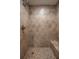 Tiled walk-in shower has a shower bench, multiple shower heads and built-in soap dish at 200 Gretchen Ct, Oldsmar, FL 34677