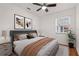 Stylish bedroom with modern decor, ceiling fan, and natural light at 210 Lake Hobbs Rd, Lutz, FL 33548