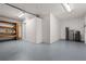 A well-lit garage with shelving, providing storage and utility space at 210 Lake Hobbs Rd, Lutz, FL 33548