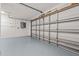 A spacious garage with a large door, promising ample parking and storage at 210 Lake Hobbs Rd, Lutz, FL 33548