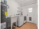 Functional laundry room with sink and washer and dryer at 210 Lake Hobbs Rd, Lutz, FL 33548