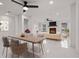 Open-concept living room with modern fireplace, recessed lighting, and polished tile flooring at 210 Lake Hobbs Rd, Lutz, FL 33548