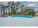 Inviting pool with screen enclosure and jacuzzi, ideal for entertaining at 210 Lake Hobbs Rd, Lutz, FL 33548