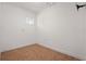 An empty room showcasing neutral paint and tiled floors, awaiting personal touches at 210 Lake Hobbs Rd, Lutz, FL 33548