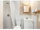 Functional bathroom with a shower, toilet, and sink at 2149 Dixie Garden Loop, Holiday, FL 34690