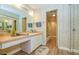 Bathroom featuring vanity with counter space, mirror, and shower/tub combination with glass doors at 2206 Cordova Grn # 2206, Seminole, FL 33777