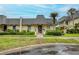 Charming townhouse featuring a unique roofline, complemented by lush landscaping and inviting curb appeal at 2206 Cordova Grn # 2206, Seminole, FL 33777