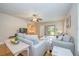 Inviting living room with neutral tones, comfortable seating, ceiling fan, and sliding glass doors to outdoor space at 2206 Cordova Grn # 2206, Seminole, FL 33777