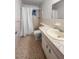 Bathroom featuring a stand up shower and vanity with a marble counter at 2460 Persian Dr # 44, Clearwater, FL 33763