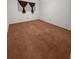 Empty bedroom with brown carpet and curtains in front of window at 2460 Persian Dr # 44, Clearwater, FL 33763