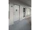 Apartment entryway featuring two doors with unit numbers and a neutral color scheme at 2460 Persian Dr # 44, Clearwater, FL 33763
