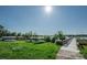 Picturesque lakeside view with boats, dock, and lush greenery at 2460 Persian Dr # 44, Clearwater, FL 33763