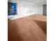 Spacious living room with windows, closet and neutral-toned carpeting at 2460 Persian Dr # 44, Clearwater, FL 33763