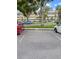 Assigned parking spot with building in the background and several cars visible at 2460 Persian Dr # 44, Clearwater, FL 33763