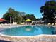 Large outdoor pool with ample seating and shaded areas for relaxation at 2460 Persian Dr # 44, Clearwater, FL 33763