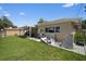 The home has a spacious backyard with a covered patio and access to household supplies at 2518 Keen Park Dr, Largo, FL 33771