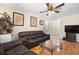 The home has a cozy living room with hardwood floors, decorative art, and comfortable seating at 2518 Keen Park Dr, Largo, FL 33771