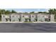 Charming townhome featuring neutral gray paint, a one car garage, and manicured landscaping at 31298 Paper Birch St, Wesley Chapel, FL 33545