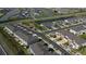 Scenic aerial shot of modern townhome community with lush landscaping and lakeside views at 34196 Polacca Ln, Wesley Chapel, FL 33543