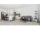 Open-concept living space connecting the kitchen with a cozy living area and outside access at 34196 Polacca Ln, Wesley Chapel, FL 33543