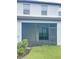 View of the back of the house with a screened in porch at 3926 Cat Mint St, Tampa, FL 33619