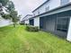 View of backyards of houses with screened in porches at 3926 Cat Mint St, Tampa, FL 33619