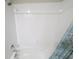 Bathroom with bathtub, shower, and tiled walls at 3926 Cat Mint St, Tampa, FL 33619