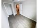 Bedroom with wood-look flooring and walk-in closet at 3926 Cat Mint St, Tampa, FL 33619