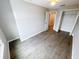 Bedroom with wood-look flooring, ceiling fan and closet at 3926 Cat Mint St, Tampa, FL 33619