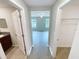 Hallway leading to bedroom, closet, and bathroom at 3926 Cat Mint St, Tampa, FL 33619