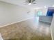 Bright living room with tile floors, a ceiling fan, and sliding glass doors to the outside at 3926 Cat Mint St, Tampa, FL 33619