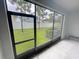 View from inside the screened in porch of the backyard at 3926 Cat Mint St, Tampa, FL 33619
