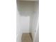 Compact walk-in closet featuring durable floors and basic shelving at 3926 Cat Mint St, Tampa, FL 33619