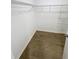 Spacious walk-in closet featuring durable wood-look floors and ample shelving at 3926 Cat Mint St, Tampa, FL 33619