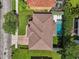 Aerial view of a private backyard with a sparkling pool, manicured landscaping, and a tile roof at 4012 W Obispo St, Tampa, FL 33629