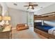 Bathroom featuring granite countertops, ornate mirror, updated fixtures, and a combined tub and shower at 4012 W Obispo St, Tampa, FL 33629