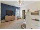 Spacious bedroom featuring blue accent wall, a dresser, and bunk beds, creating a playful and functional space at 4012 W Obispo St, Tampa, FL 33629