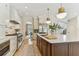 Spacious kitchen with an island, stainless steel appliances, custom cabinets, and an open layout at 4012 W Obispo St, Tampa, FL 33629