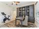 Inviting office space with custom built-ins, a spacious desk, and a peloton bike for workouts at 4012 W Obispo St, Tampa, FL 33629