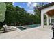 Beautiful backyard with a pristine pool, spa, and covered patio with plenty of seating at 4012 W Obispo St, Tampa, FL 33629