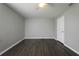 Spacious bedroom with ceiling fan, hardwood floors, and closet at 5018 Pine St, Seffner, FL 33584