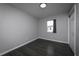 This bedroom offers modern flooring, neutral paint, a window, and a closet at 5018 Pine St, Seffner, FL 33584