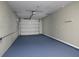 This garage features painted floors, fresh paint and an automatic garage door at 5018 Pine St, Seffner, FL 33584
