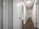 Hallway featuring newly installed dark hardwood floors and fresh gray paint at 5018 Pine St, Seffner, FL 33584