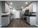 Well-designed kitchen featuring stainless steel appliances and ample storage in gray cabinets at 5018 Pine St, Seffner, FL 33584