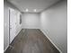 The living room has wood floors and fresh paint at 5018 Pine St, Seffner, FL 33584